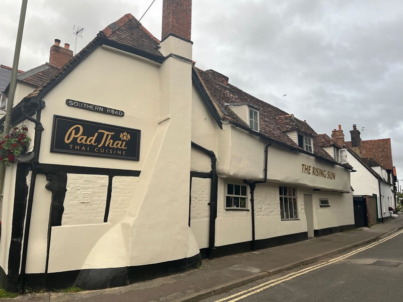 Exterior Painting Of The Rising Sun In Thame
